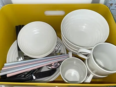 a yellow tray filled with dishes and utensils at Budget Private StayIkebukuro Anime Area Sleeps 7 in Tokyo
