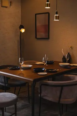 a wooden table in a restaurant with chairs and a tableablish at \u30a2\u30d0\u30f4\u6e0b\u8c37\u30d3\u30eb2\u968e in Tokyo