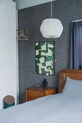a bedroom with a bed and a pendant light at \u30a2\u30d0\u30f4\u6e0b\u8c37\u30d3\u30eb2\u968e in Tokyo