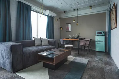 a living room with a couch and a table at \u30a2\u30d0\u30f4\u6e0b\u8c37\u30d3\u30eb2\u968e in Tokyo