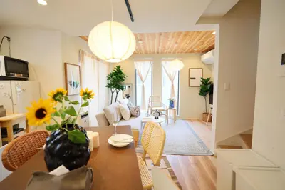 a kitchen and living room with a table and chairs at Ikebukuro Infinity Grove Villa in Tokyo