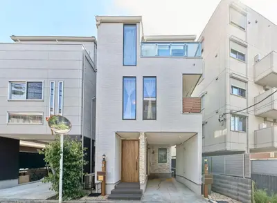 a house with a wooden door in front of it at Ikebukuro Infinity Grove Villa in Tokyo