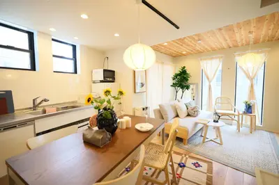 a kitchen and living room with a table and a couch at Ikebukuro Infinity Grove Villa in Tokyo