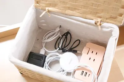 a basket with electronics in it on a table at \u99c5\u304b\u3089\u5f92\u6b695\u5206\u6c60\u888b\u307e\u3067\u96fb\u8eca\u30675\u5206\u306e\u597d\u7acb\u5730 in Tokyo