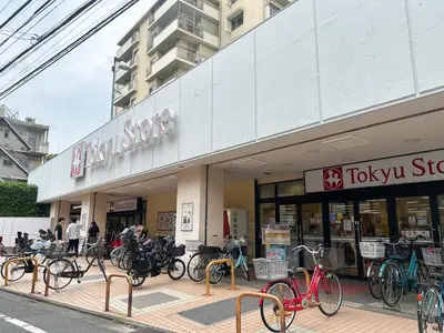 a store with a bunch of bikes parked outside of it at \u99c5\u304b\u3089\u5f92\u6b695\u5206\u6c60\u888b\u307e\u3067\u96fb\u8eca\u30675\u5206\u306e\u597d\u7acb\u5730 in Tokyo