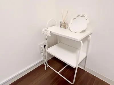 a white table with a mirror on a shelf at Suke Home Oshiage in Tokyo