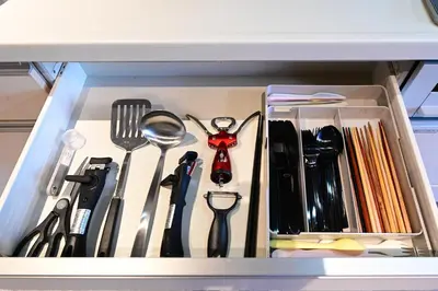 a drawer filled with various utensils and a drawer at Rakuna Inn \u8679 Oshiage2 in Tokyo