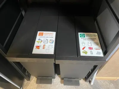 two signs sitting on top of a black table at Rakuna Inn \u8679 Oshiage2 in Tokyo