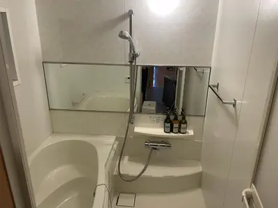 a bathroom with a shower and a sink and a tub at Rakuna Inn \u8679 Oshiage2 in Tokyo