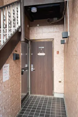a door in a building with a hanger on it at RENTO Ikebukuro 101 in Tokyo