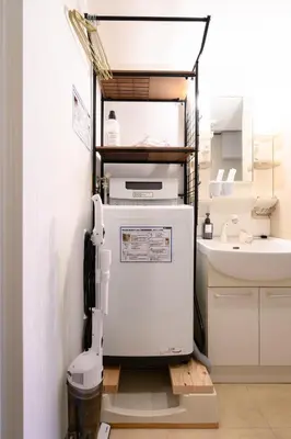 a refrigerator in a kitchen with a sink at RENTO Ikebukuro 301 in Tokyo