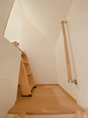 a staircase in a room with a stair railing at nestay suite tokyo mejiro in Tokyo