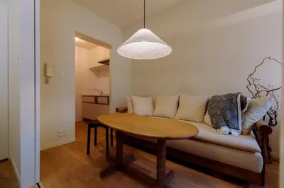 a living room with a couch and a table at The Apartment Hotel Ebisu 1 in Tokyo