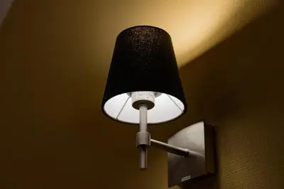 a black and white lamp on a wall at \u30db\u30c6\u30eb\u30a6\u30a4\u30eb\u30b7\u30c6\u30a3\u6d45\u8349\u672c\u9928 in Tokyo