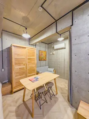 a dining room with a wooden table and chairs at ideas ASAKUSA Hotel in Tokyo