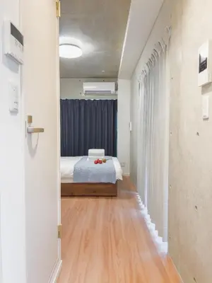a bedroom with a bed in the middle of a room at ideas ASAKUSA Hotel in Tokyo