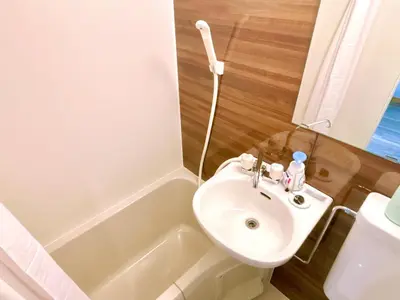 a small bathroom with a sink and a toilet at 107, Shinjuku City, JR Yamanote Line, 6 min walk to stn in Tokyo