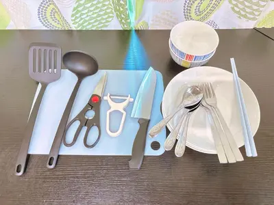 a table with a plate and utensils on a table at 107, Shinjuku City, JR Yamanote Line, 6 min walk to stn in Tokyo