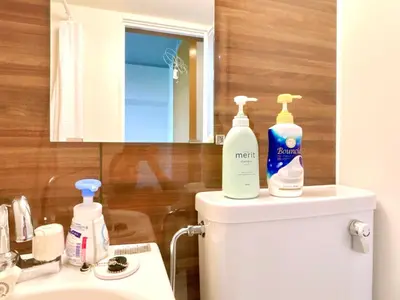 a bathroom with a toilet with two bottles on it at 107, Shinjuku City, JR Yamanote Line, 6 min walk to stn in Tokyo