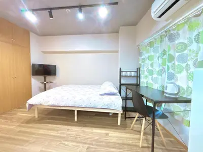 a bedroom with a bed and a desk and a table at 107, Shinjuku City, JR Yamanote Line, 6 min walk to stn in Tokyo