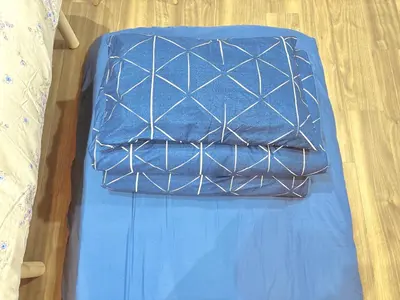 a blue table with two pillows on top of it at 107, Shinjuku City, JR Yamanote Line, 6 min walk to stn in Tokyo