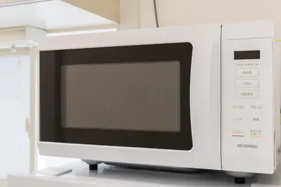 a white microwave oven sitting on top of a counter at Luxury Tokyo Stay I 120sqm 4LDK I Close to Shibuya & Shinjuku Area in Tokyo