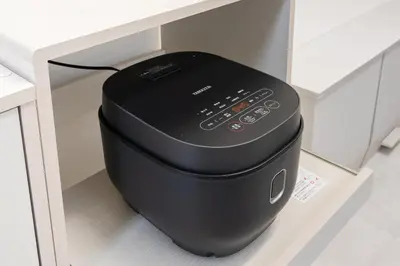 a black pot sitting in a kitchen drawer at Luxury Tokyo Stay I 120sqm 4LDK I Close to Shibuya & Shinjuku Area in Tokyo