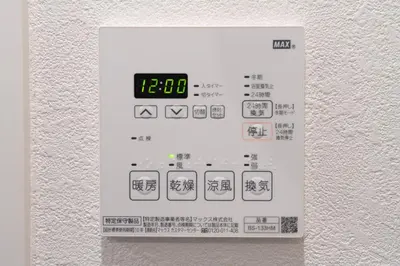 a sign on a wall with a clock on it at Artessimo \u62bc\u4e0a402 in Tokyo