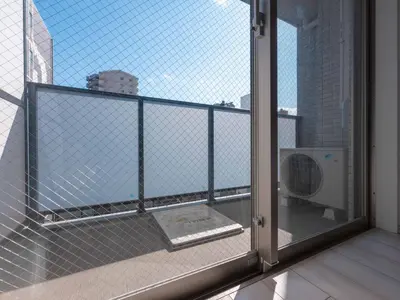 an open door to a balcony with a fan at Artessimo \u62bc\u4e0a402 in Tokyo