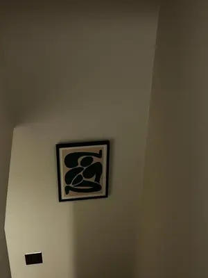 a picture on a wall with a sign on it at \u5317\u6e0b\u8c37inn in Tokyo