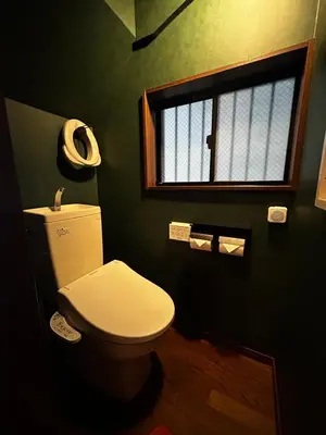 a bathroom with a white toilet and a window at \u5317\u6e0b\u8c37inn in Tokyo