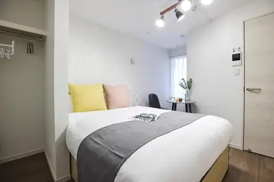 a bedroom with a large bed in a room at THE Dorchester β in Tokyo