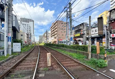 an empty train track in a city with buildings at \u30a2\u30b9\u30d4\u30a2403 in Tokyo