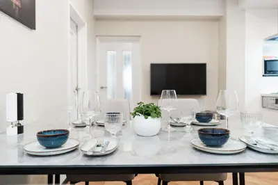 a dining room with a table with glasses and plates at Yy-\u7be0\u516c\u5bd33LDK-TS0376 in Tokyo