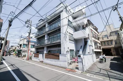 a building on a city street with power lines at Yy-\u7be0\u516c\u5bd33LDK-TS0376 in Tokyo