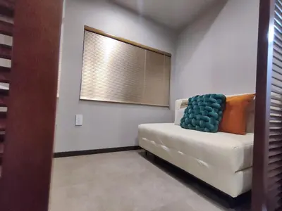 a living room with a white couch and a window at D1 Shinjuku JR St 8 mins 2 bedrooms and 1 living room Max 5P Direct to Shinjuku Ueno Ginza Shibuya Ikebukuro Yoyogi Shinagawa \u65b0\u5bbf\u533a \u9ad8\u7530\u9a6c\u573a\u8f66\u7ad98\u5206\u949f \u4e24\u5ba4\u4e00\u5385 \u6700\u59275\u4eba in Tokyo