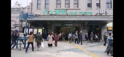 a group of people walking in front of a building at The Bella Ueno in Tokyo