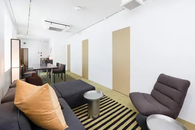a living room with a couch and chairs and a table at JAPAVISTA r4 in Tokyo