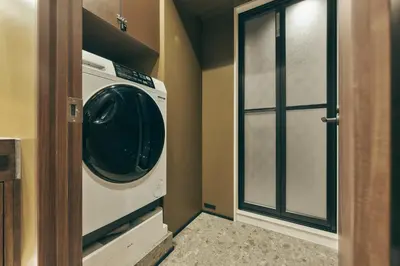 a laundry room with a washing machine in it at illi Lay Shibuya-Ebisu in Tokyo