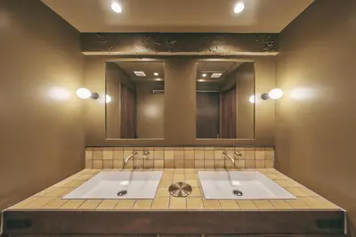 a bathroom with two sinks and two mirrors at illi Lay Shibuya-Ebisu in Tokyo
