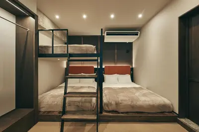 a small room with bunk beds and a bed at illi Lay Shibuya-Ebisu in Tokyo