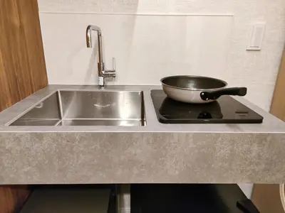 a kitchen with a sink and a frying pan on a stove at C2 Shinjuku JR St 8 mins 2 bedrooms and 1 living room Max 5P Direct to Shinjuku Ueno Ginza Shibuya Ikebukuro Yoyogi Shinagawa \u65b0\u5bbf\u533a \u9ad8\u7530\u9a6c\u573a\u8f66\u7ad98\u5206\u949f \u4e24\u5ba4\u4e00\u5385 \u6700\u59275\u4eba in Tokyo