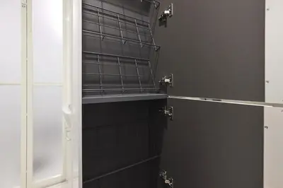 a bathroom with a black tiled wall at THE Dorchester α in Tokyo