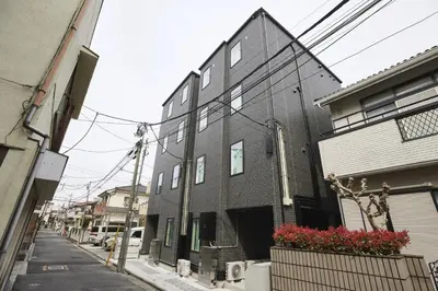 a black building on a city street with at THE Dorchester α in Tokyo