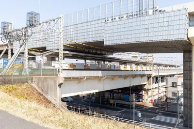 a building with a bridge with a train on it at THE Dorchester α in Tokyo