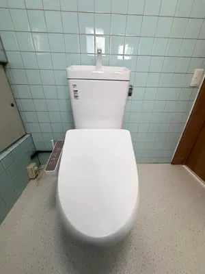 a bathroom with a white toilet in a stall at \u532f\u91d1\u829d\u6d66\u30d3\u30eb in Tokyo