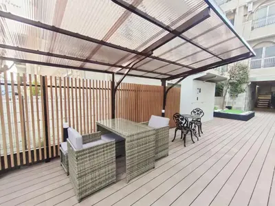 a pergola on a deck with a table and chairs at B6 Shinjuku JR St 8 mins 2 bedrooms and 1 living room Max 5P Direct to Shinjuku Ueno Ginza Shibuya Ikebukuro Yoyogi Shinagawa \u65b0\u5bbf\u533a \u9ad8\u7530\u9a6c\u573a\u8f66\u7ad98\u5206\u949f \u4e24\u5ba4\u4e00\u5385 \u6700\u59275\u4eba in Tokyo