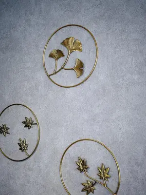 four gold rings with leaves on a table at Nihonbashi Hamacho Hotel Fortuna, PH 50m2, 3min, 4pax in Tokyo