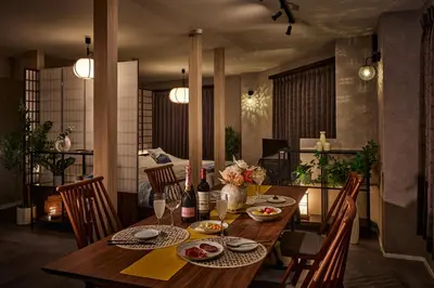 a dining room table with plates of food on it at Nihonbashi Hamacho Hotel Fortuna, PH 50m2, 3min, 4pax in Tokyo