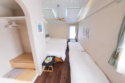a small room with two beds and a window at GOOD DAY Shinagawa HOTEL in Tokyo